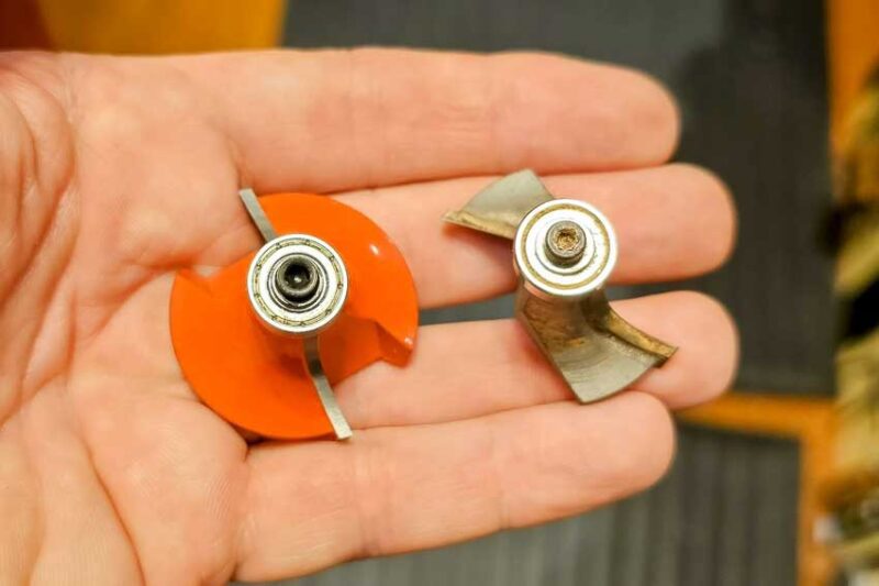 Anti-kickback bit on the left and older non-anti-kickback style on the right. The extra metal on the left keeps you from feeding the wood in too fast behind the cutter. Without it the bit can grab the wood and hurling it at you. 